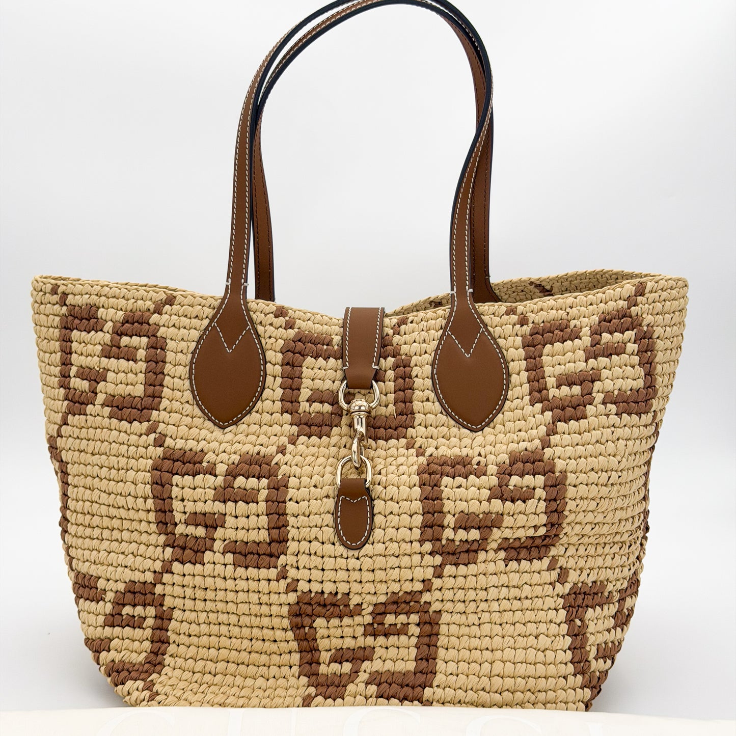 Brand new unworn Gucci GG raffia tote front view
