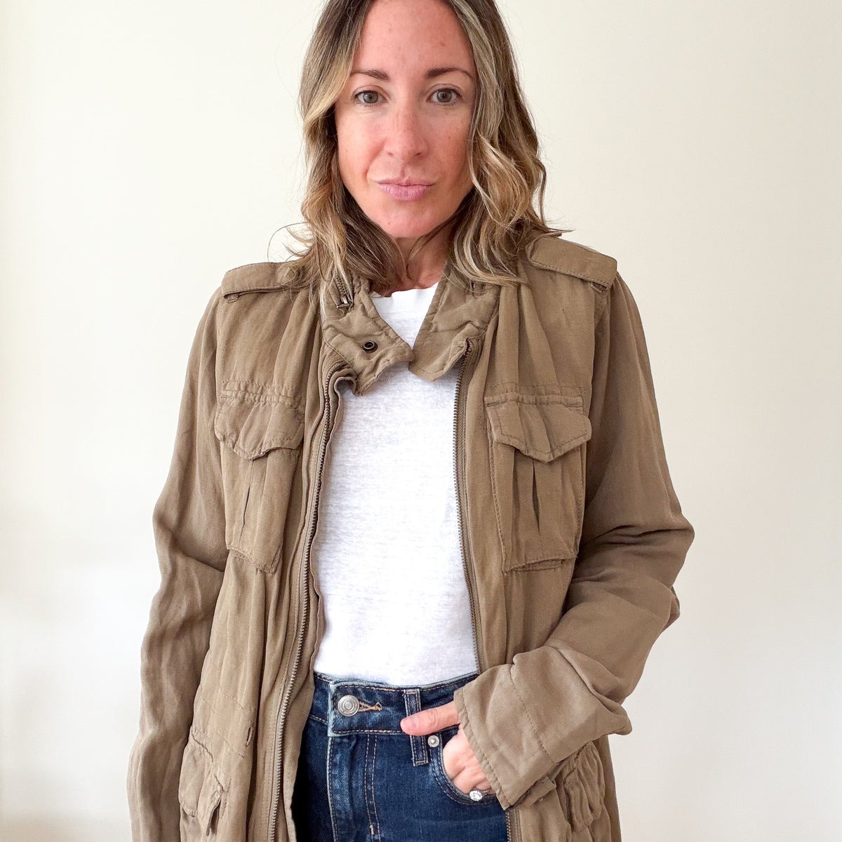 Close-up of the Maison Scotch khaki utility jacket's zip and hardware detail