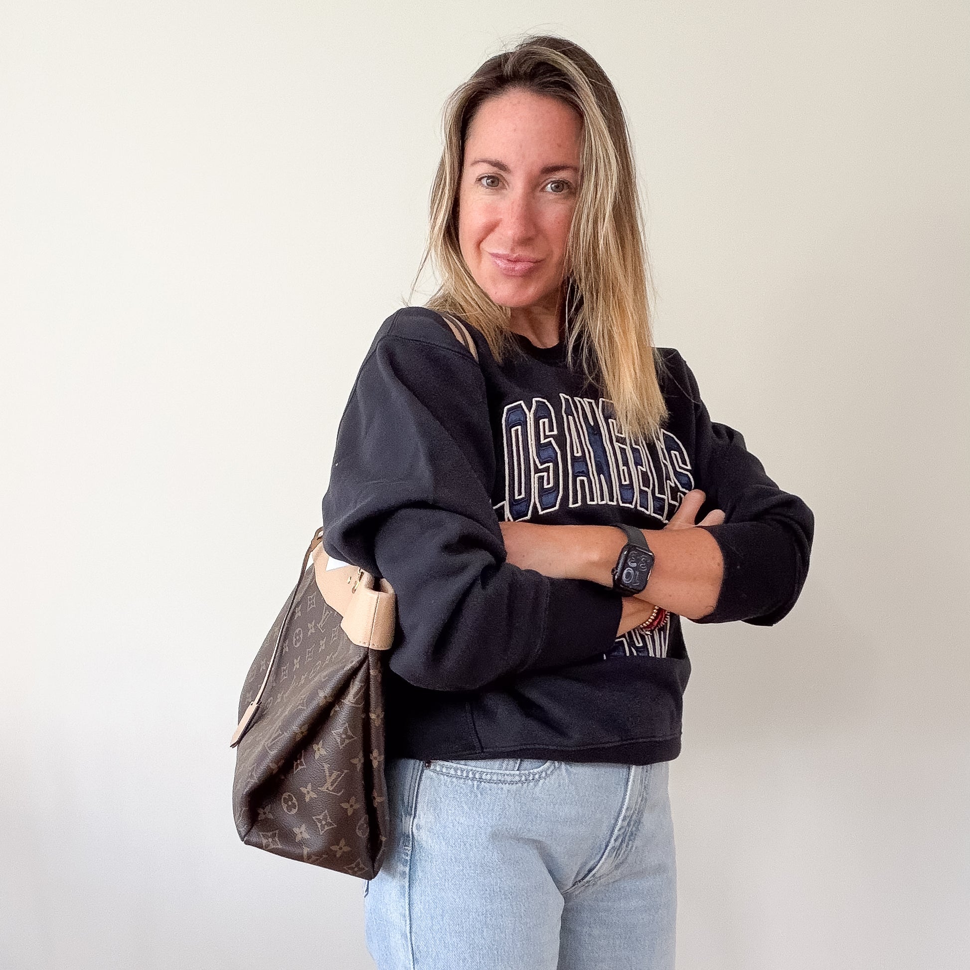Anine Bing Shrunken Harry sweatshirt — styled with Louis Vuitton bag, full outfit view