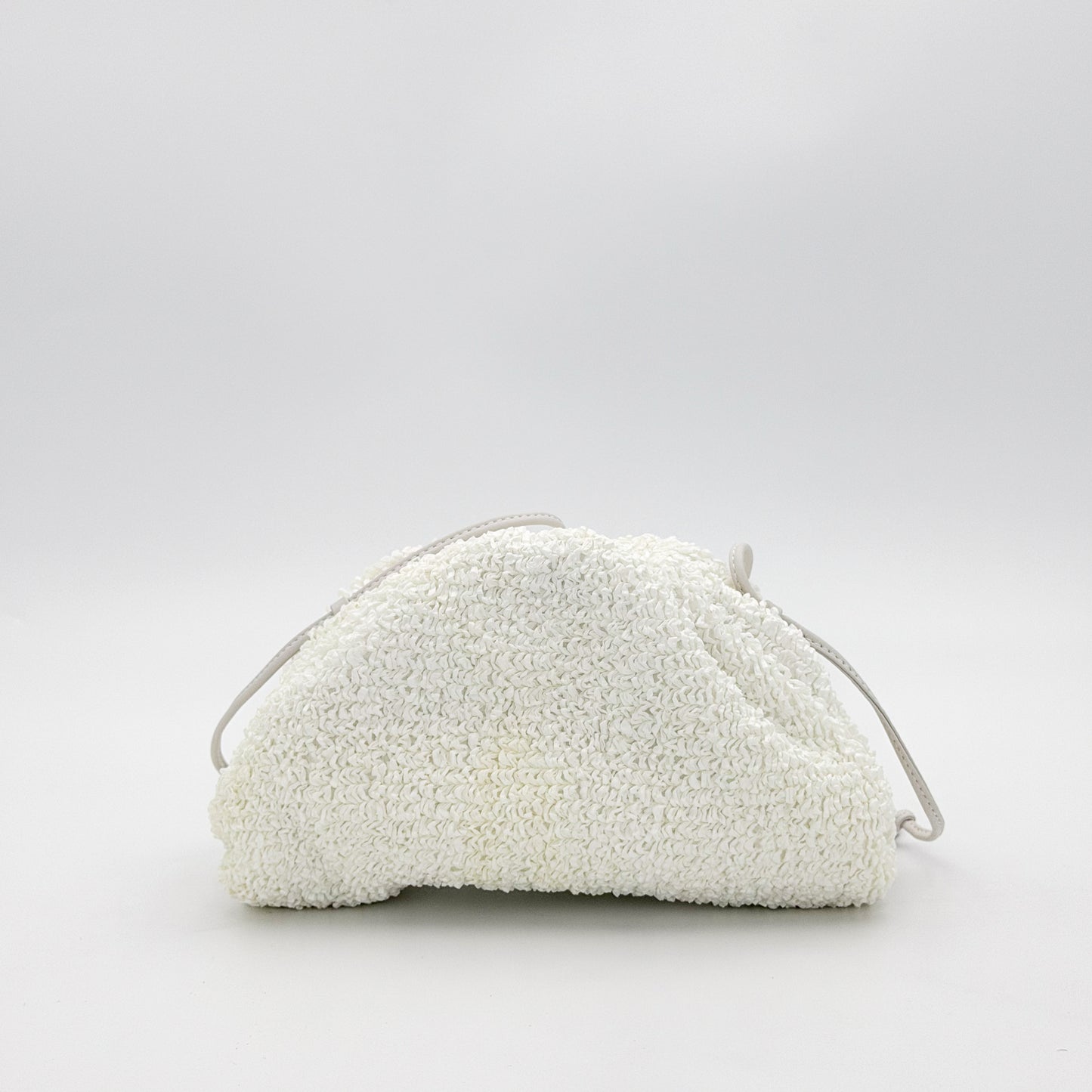 Bottega Veneta Mini Pouch front angled view with knotted leather strap