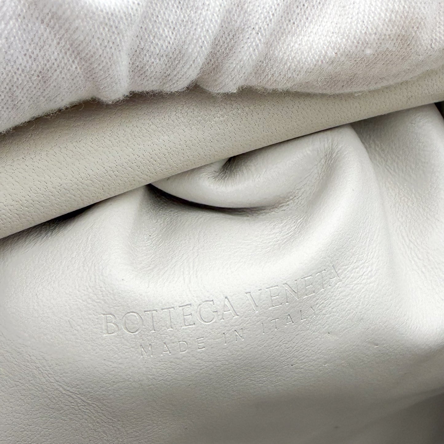 Bottega Veneta interior leather stamp and authenticity tag close-up