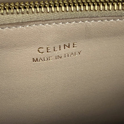 Céline wallet – close-up of gold zip pocket and "Céline Made in Italy" interior stamp
