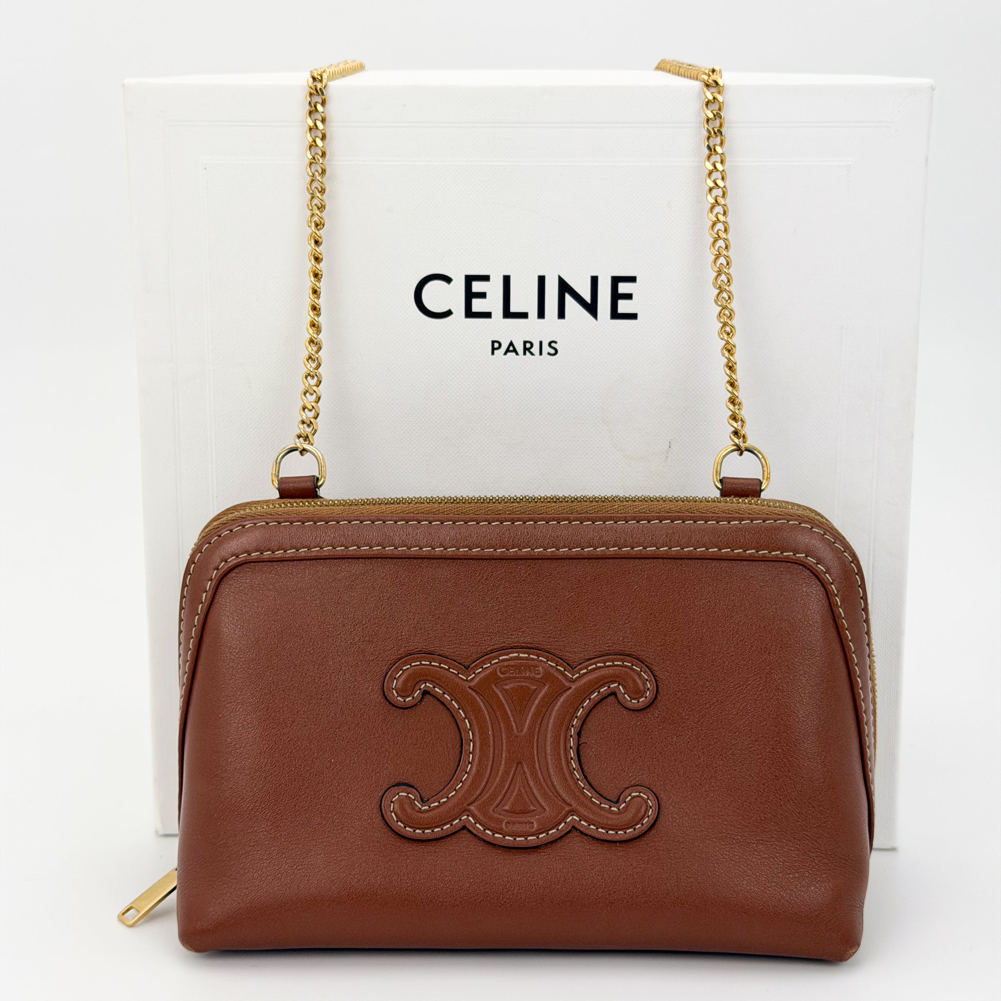 Preloved Celine Cuir Triomphe clutch on chain tan leather with Celine box front view