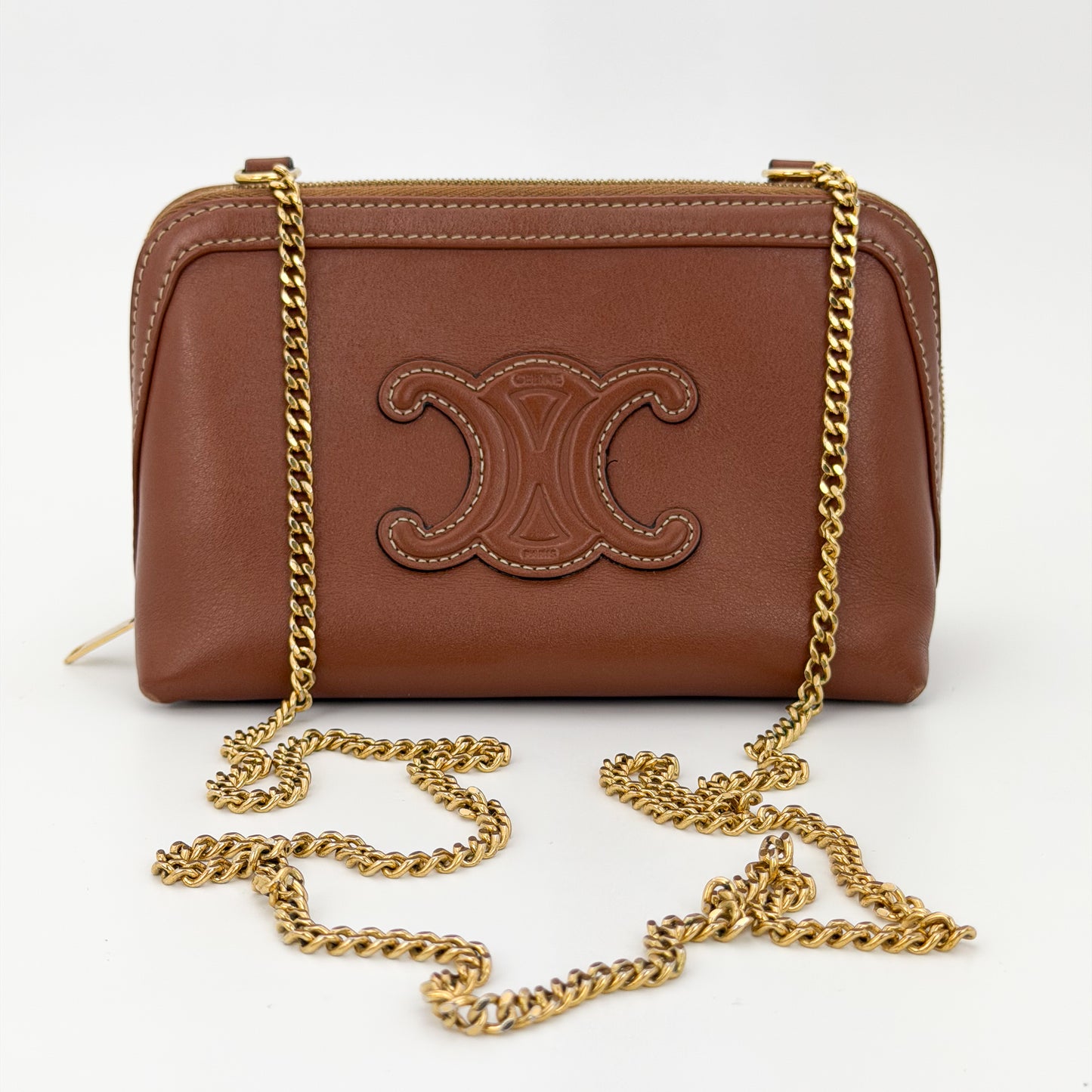 Second hand Celine Triomphe tan leather clutch on chain gold chain crossbody view
