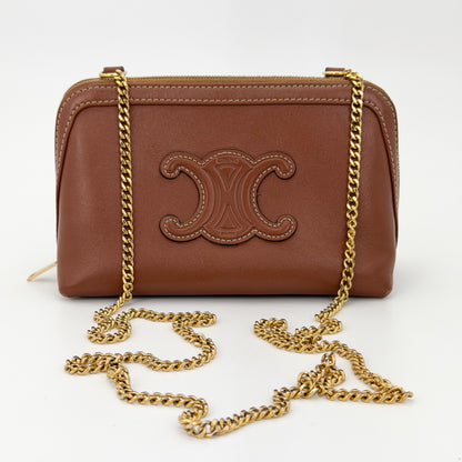 Second hand Celine Triomphe tan leather clutch on chain gold chain crossbody view