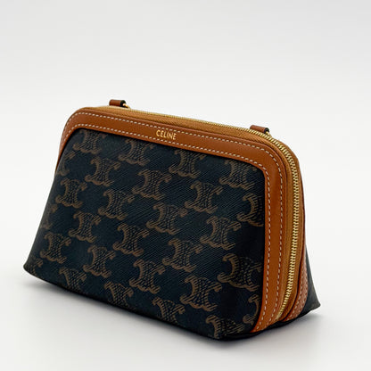 Celine Cuir Triomphe clutch side view showing CELINE debossed leather trim