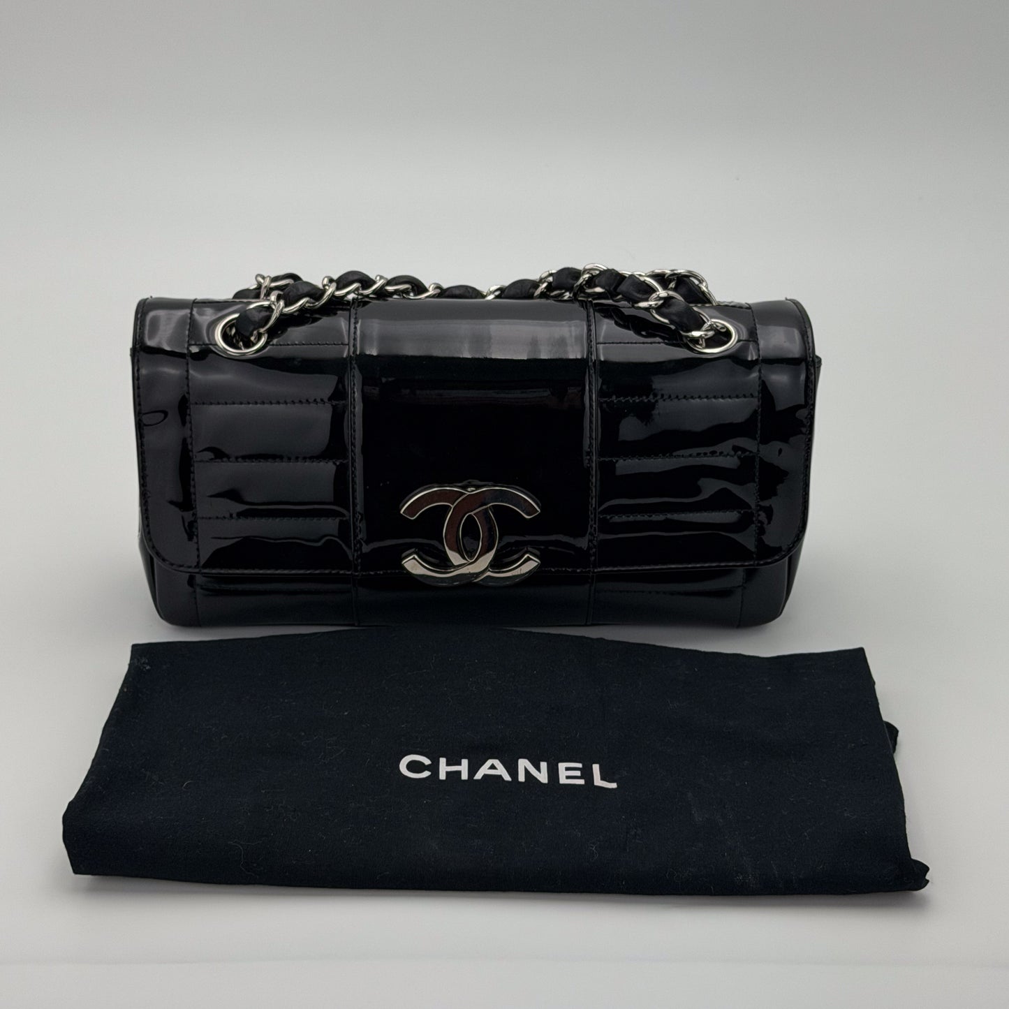 Interior of preloved Chanel vertical stitch flap bag, printed Chanel jacquard fabric lining and Made in France tag