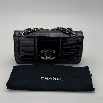 Interior of preloved Chanel vertical stitch flap bag, printed Chanel jacquard fabric lining and Made in France tag