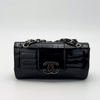 Vintage preloved Chanel vertical stitch black patent leather flap bag circa 2005, front view 