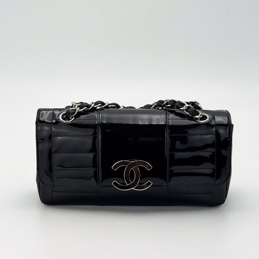 Vintage preloved Chanel vertical stitch black patent leather flap bag circa 2005, front view 