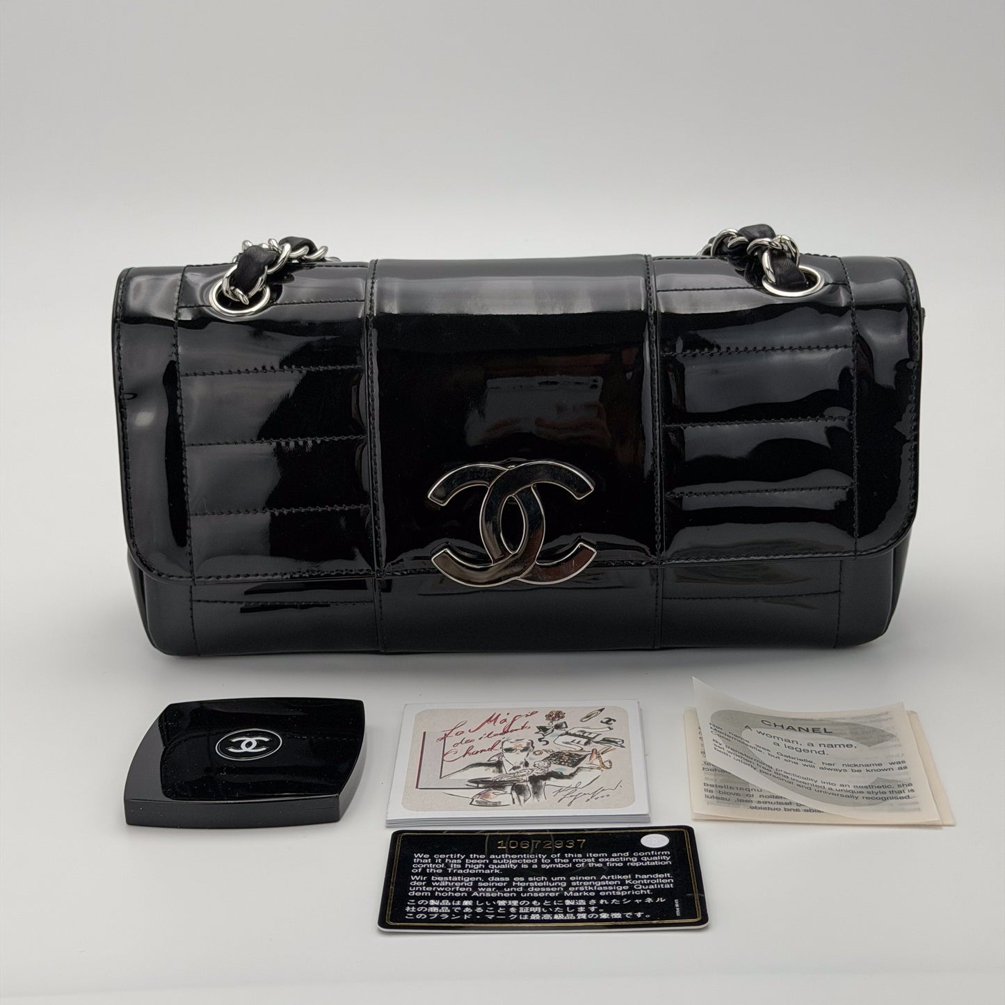 Vintage preloved Chanel vertical stitch black patent leather flap bag circa 2005, front view, mirror, booklets and authenticity card
