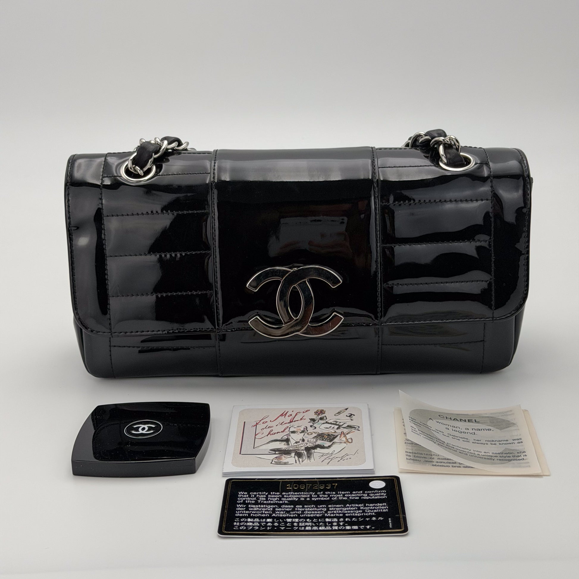 Vintage preloved Chanel vertical stitch black patent leather flap bag circa 2005, front view, mirror, booklets and authenticity card