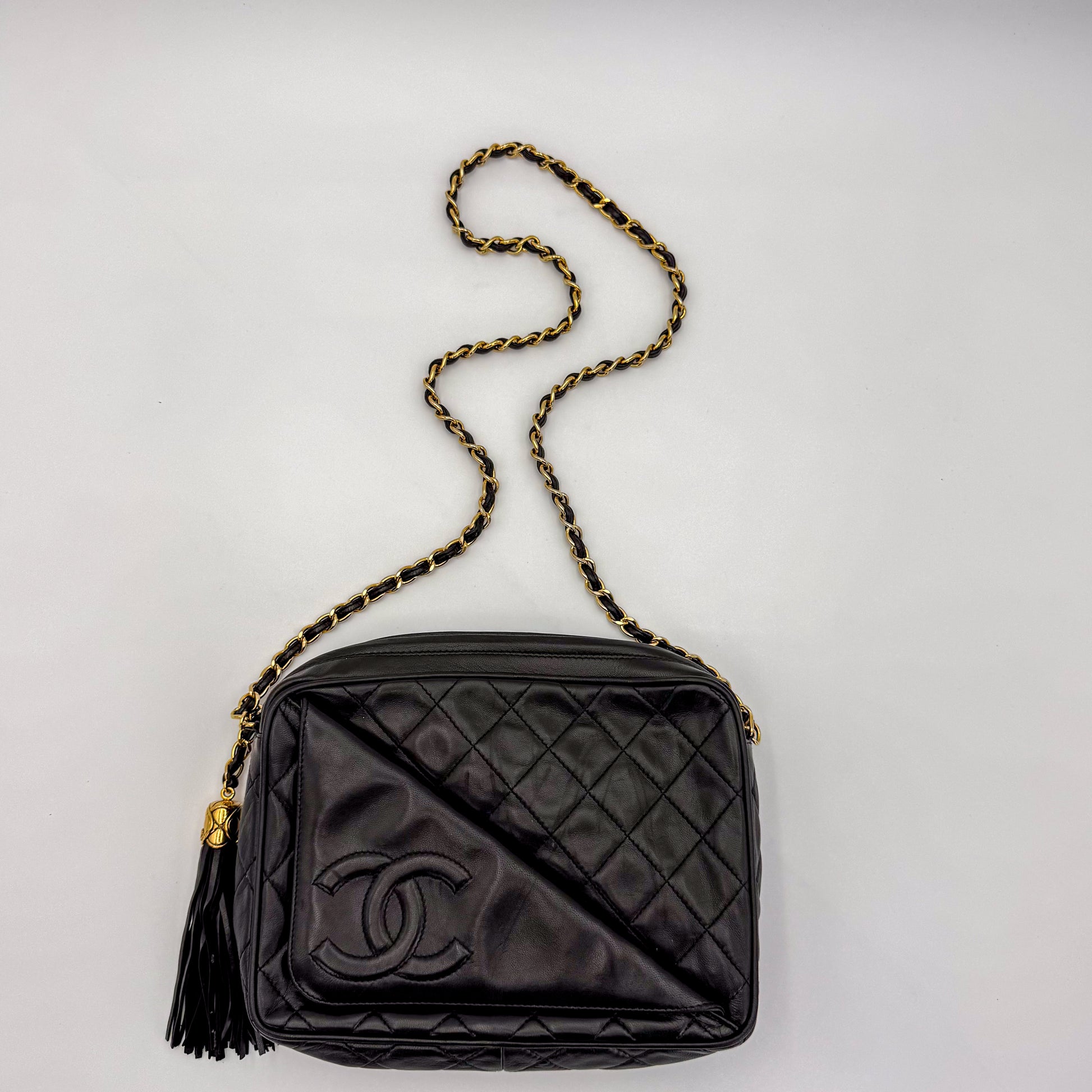 Vintage Chanel black quilted lambskin tassel camera bag Ariel view