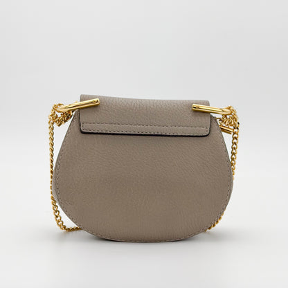 Used Chloé Mini Drew taupe leather bag back view plain leather panel