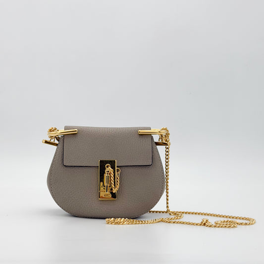 Chloé Mini Drew taupe grained leather crossbody bag front view with chain strap