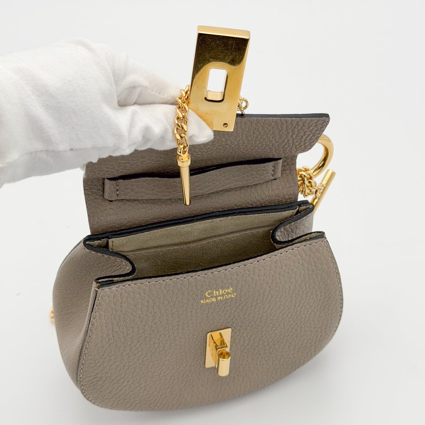 Chloé Mini Drew crossbody bag interior view showing suede lining and hardware