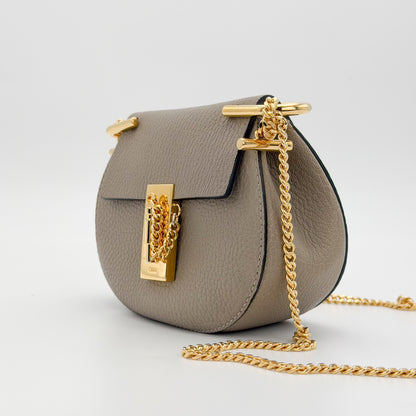 Used Chloé Mini Drew taupe leather bag front view with full chain strap