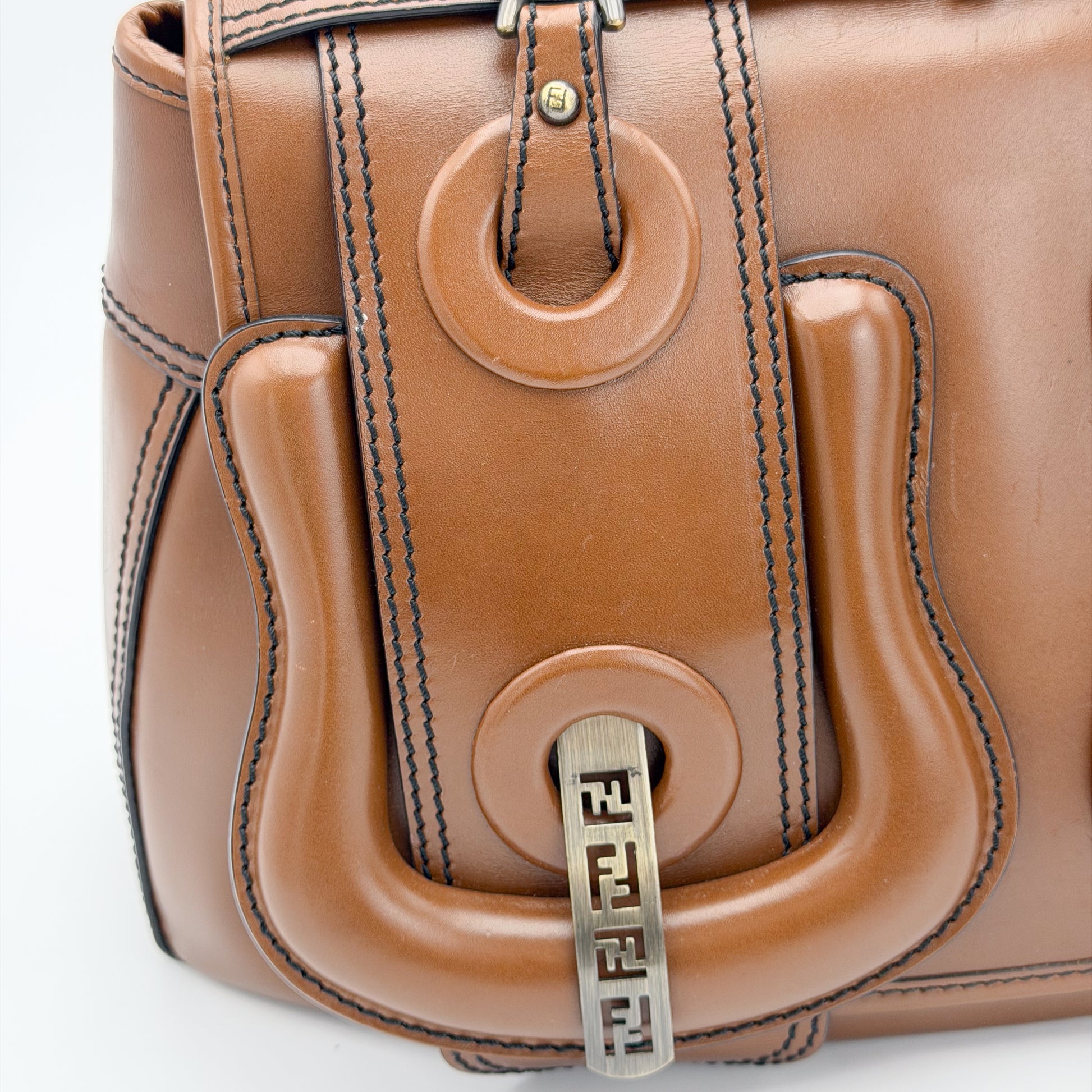 Fendi FF buckle hardware close up on tan leather