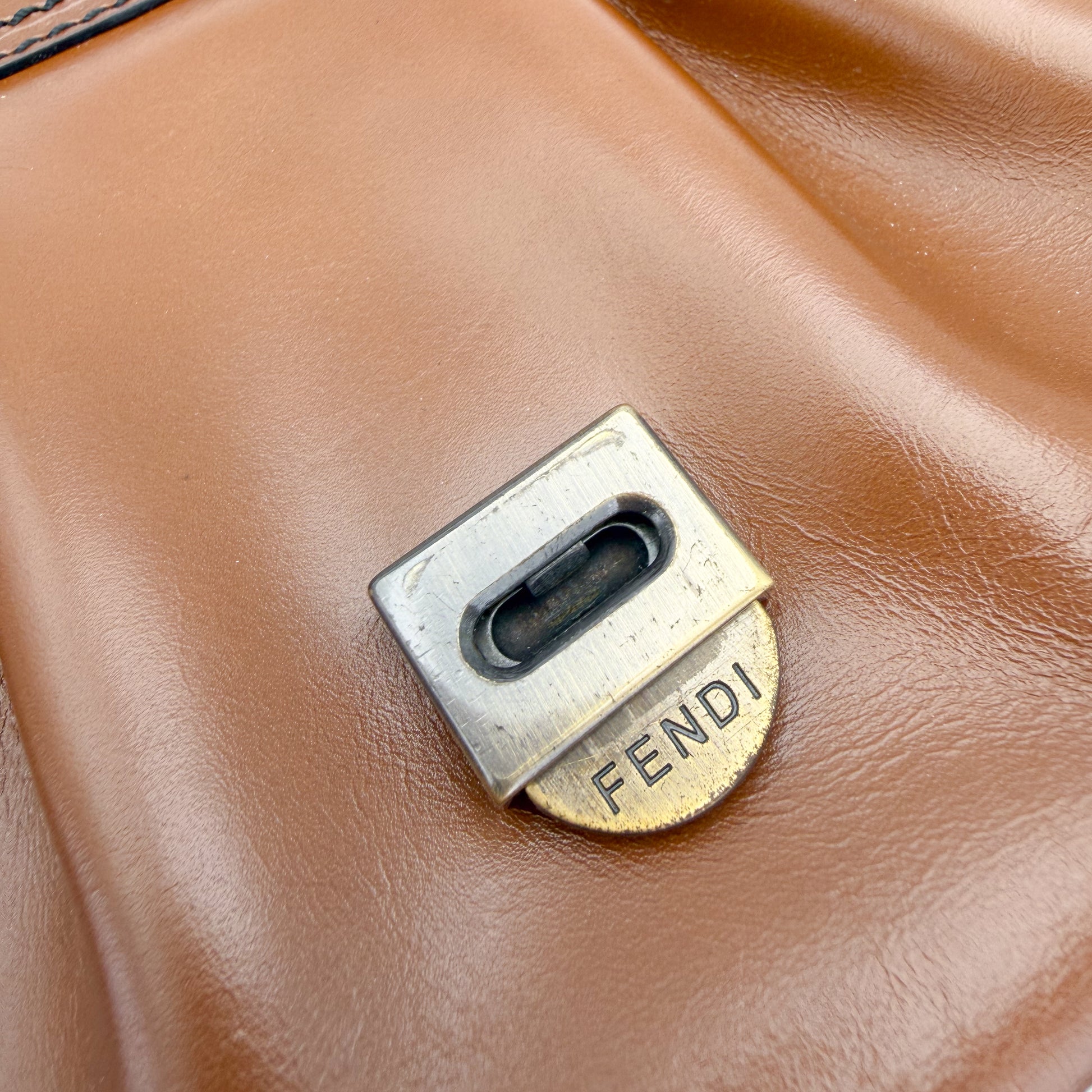  Fendi hardware close up showing engraved Fendi push-lock closure