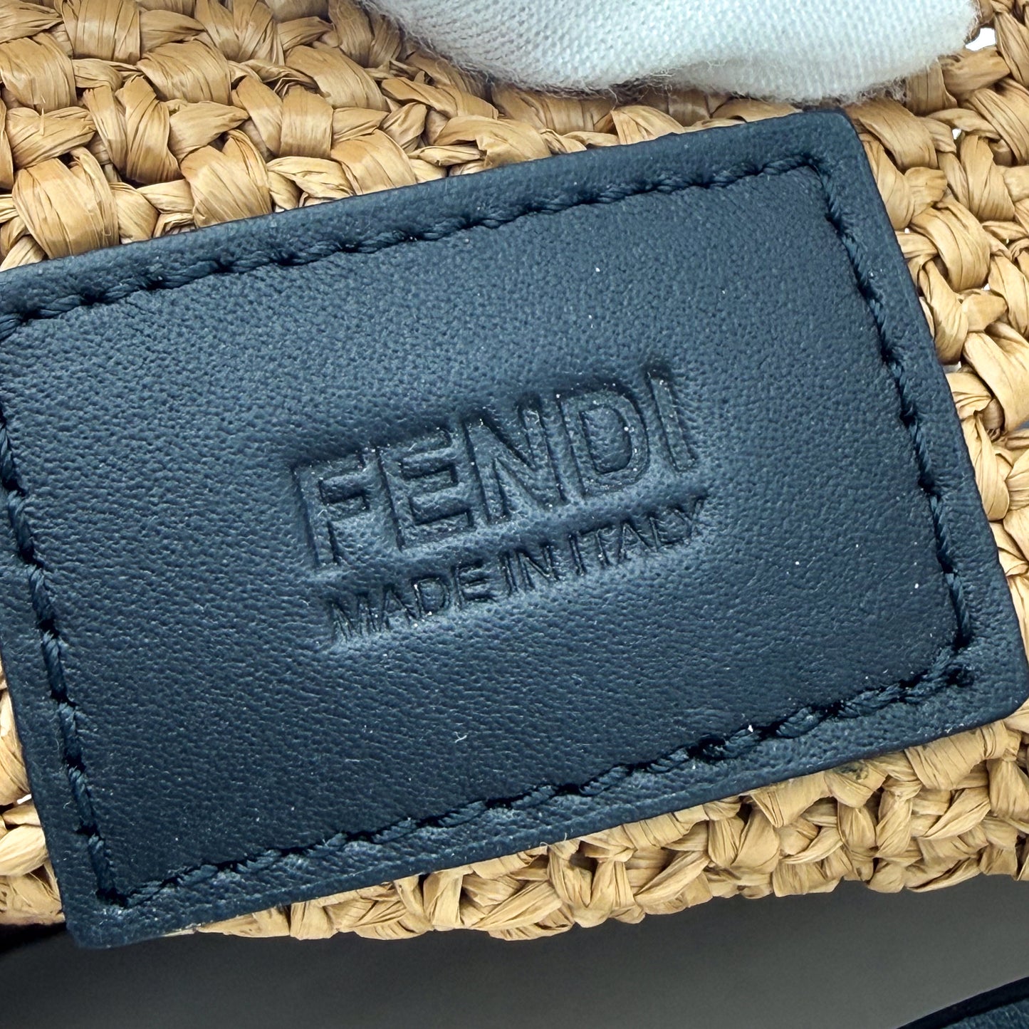 Authentic preloved Fendi Roma raffia oversized tote bag with interior logo close up