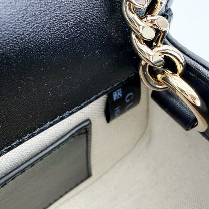 Gucci Blondie bag interior view showing cotton-linen lining and chain