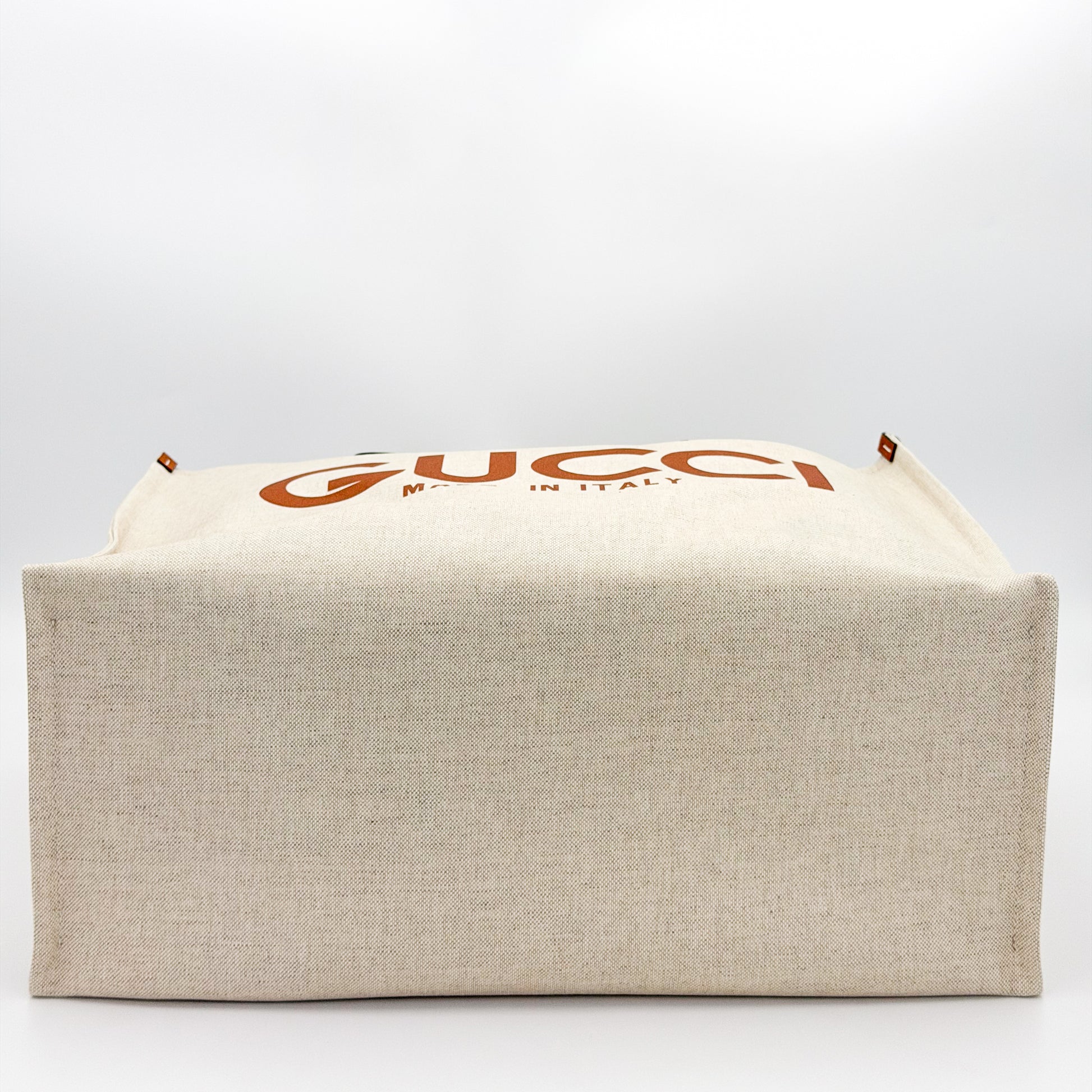 Authentic brand new Gucci canvas tote base view