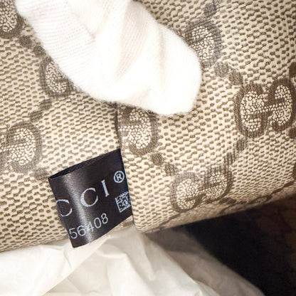 Unworn Gucci logo print tote corner detail showing fabric serial number
