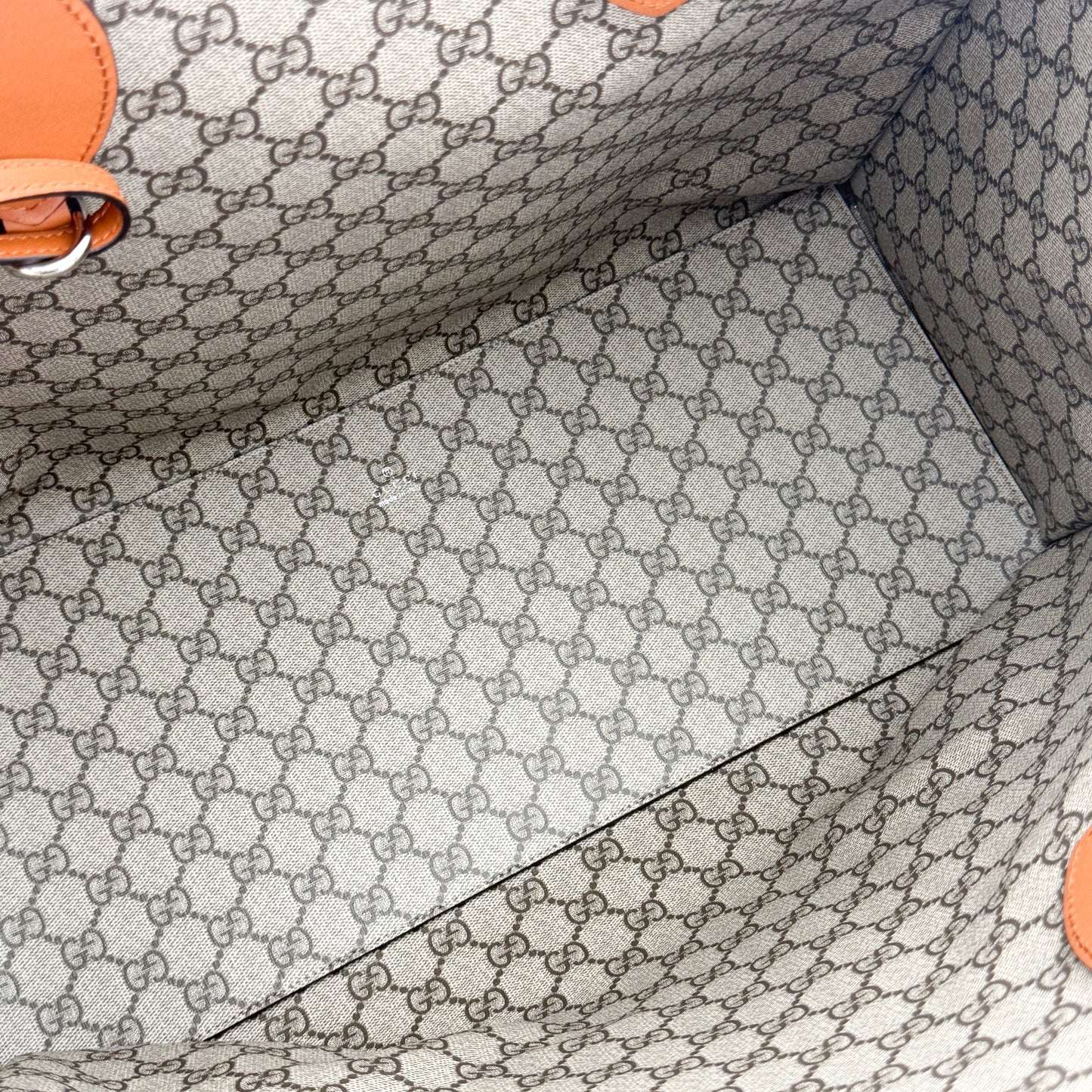 Gucci logo print tote base view showing canvas construction