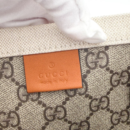Unworn Gucci logo print tote corner detail showing leather trim stitching