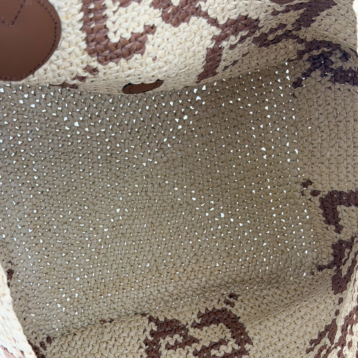 Brand new Gucci raffia tote base view showing woven construction