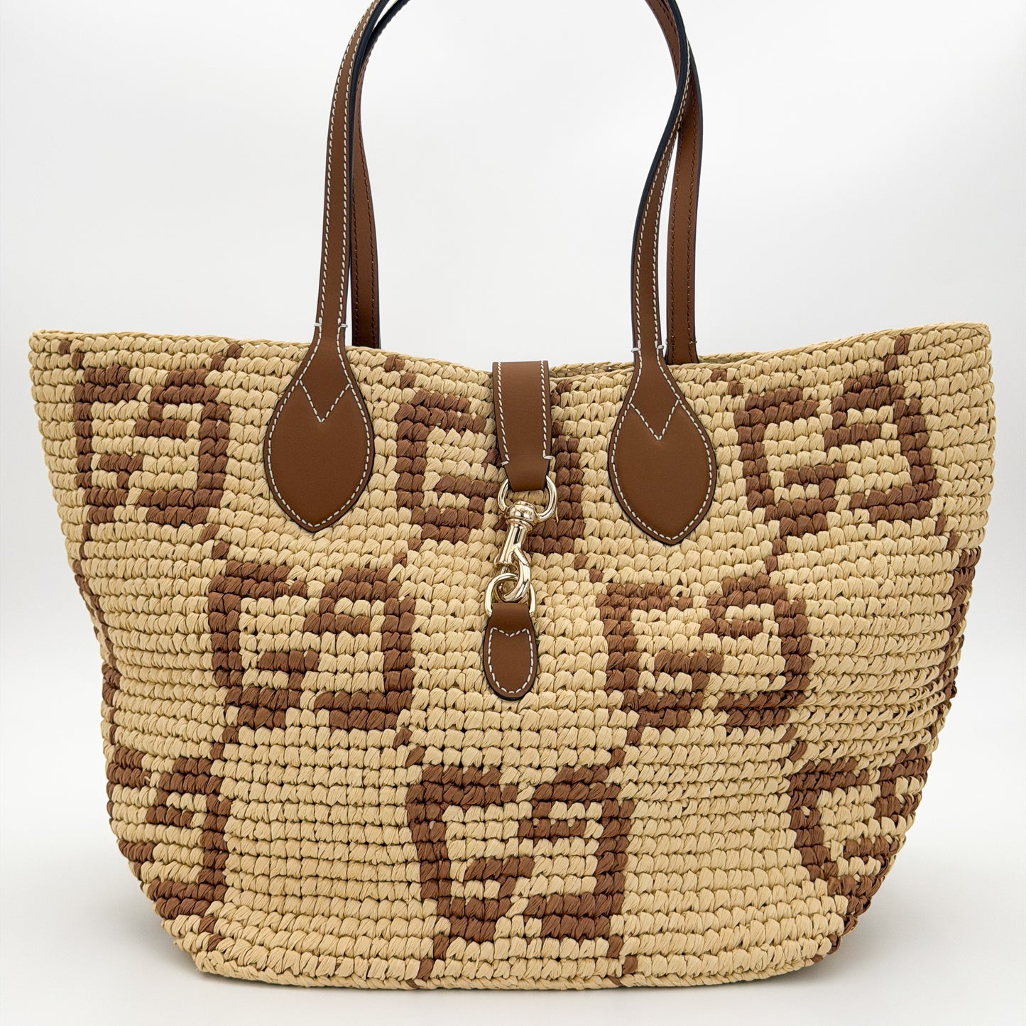 Brand new unworn Gucci GG raffia tote front view with woven pattern and leather trim