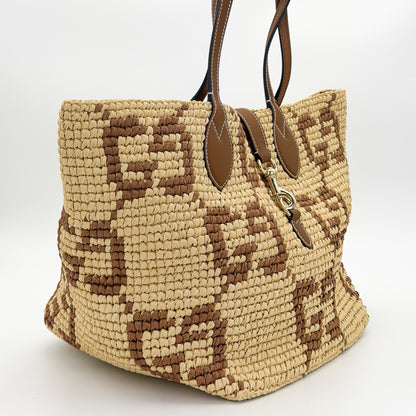 Gucci raffia tote right side view showing crochet weave and tan leather handles