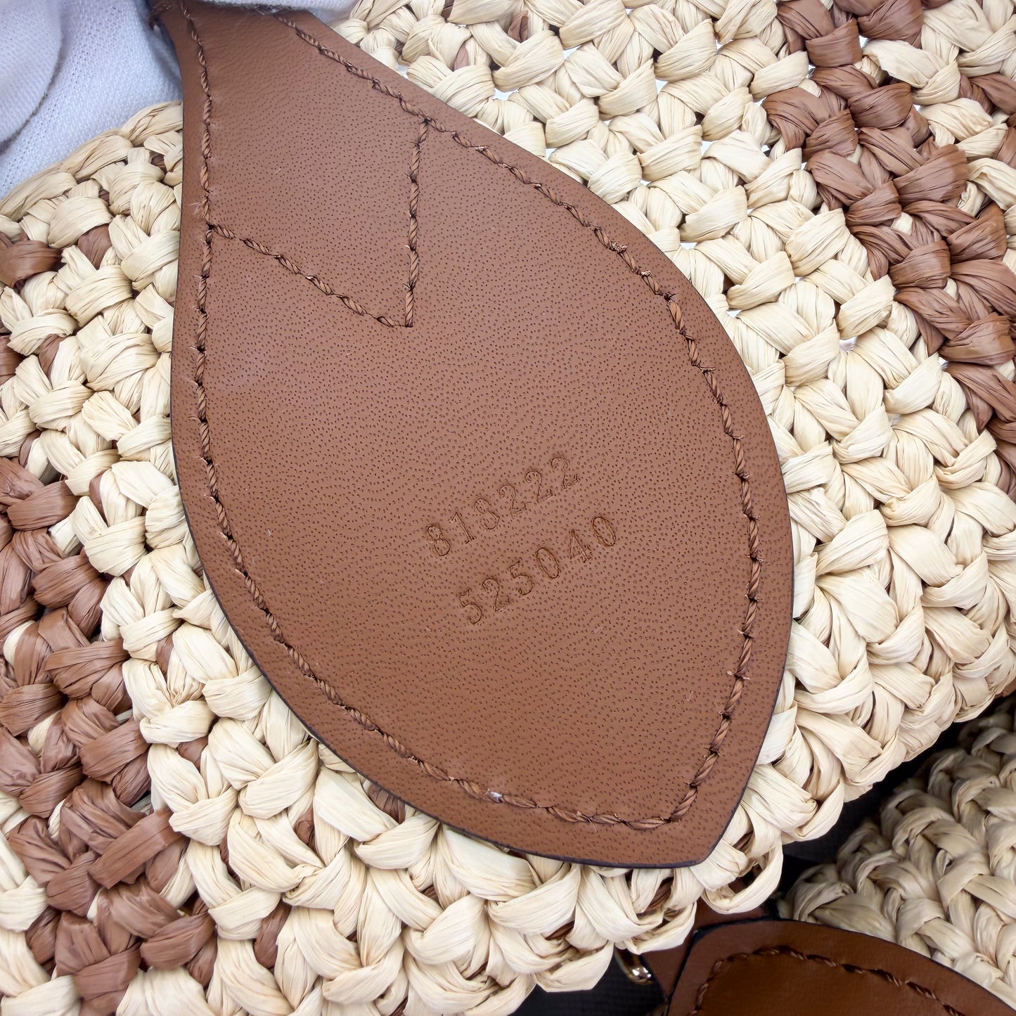 Gucci raffia tote authenticity leather patch with serial number stamp
