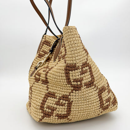 Brand new Gucci raffia tote side view 