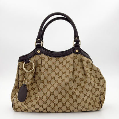 Brand new unworn Gucci Sukey GG canvas tote front view with leather trim and charm