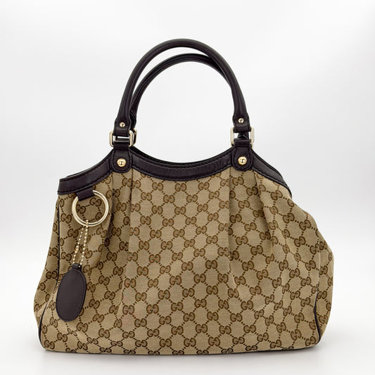 Brand new unworn Gucci Sukey GG canvas tote front view with leather trim and charm