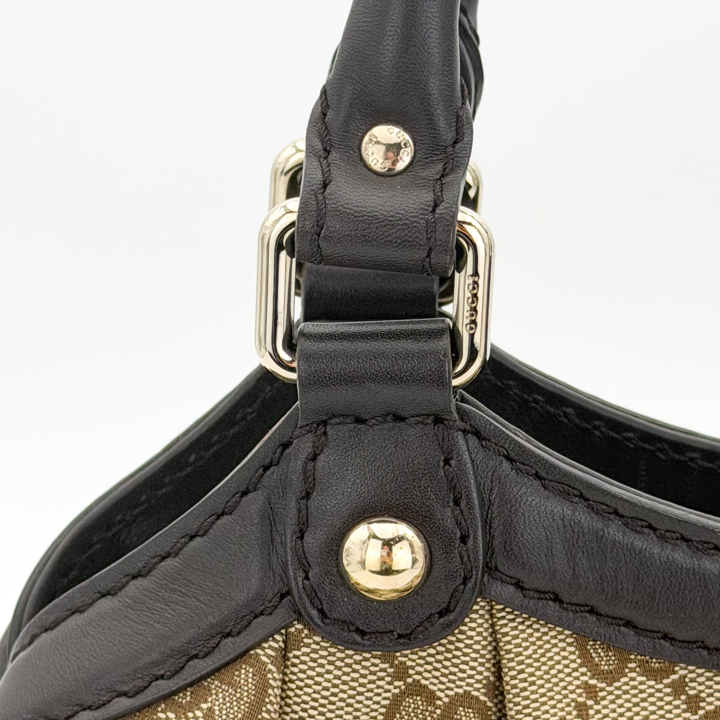 Brand new unworn Gucci Sukey GG canvas tote front view with leather trim and charm