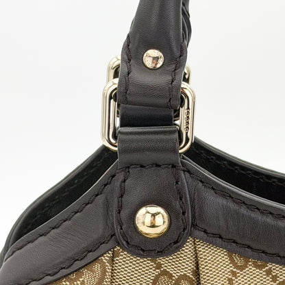 Brand new unworn Gucci Sukey GG canvas tote front view with leather trim and charm