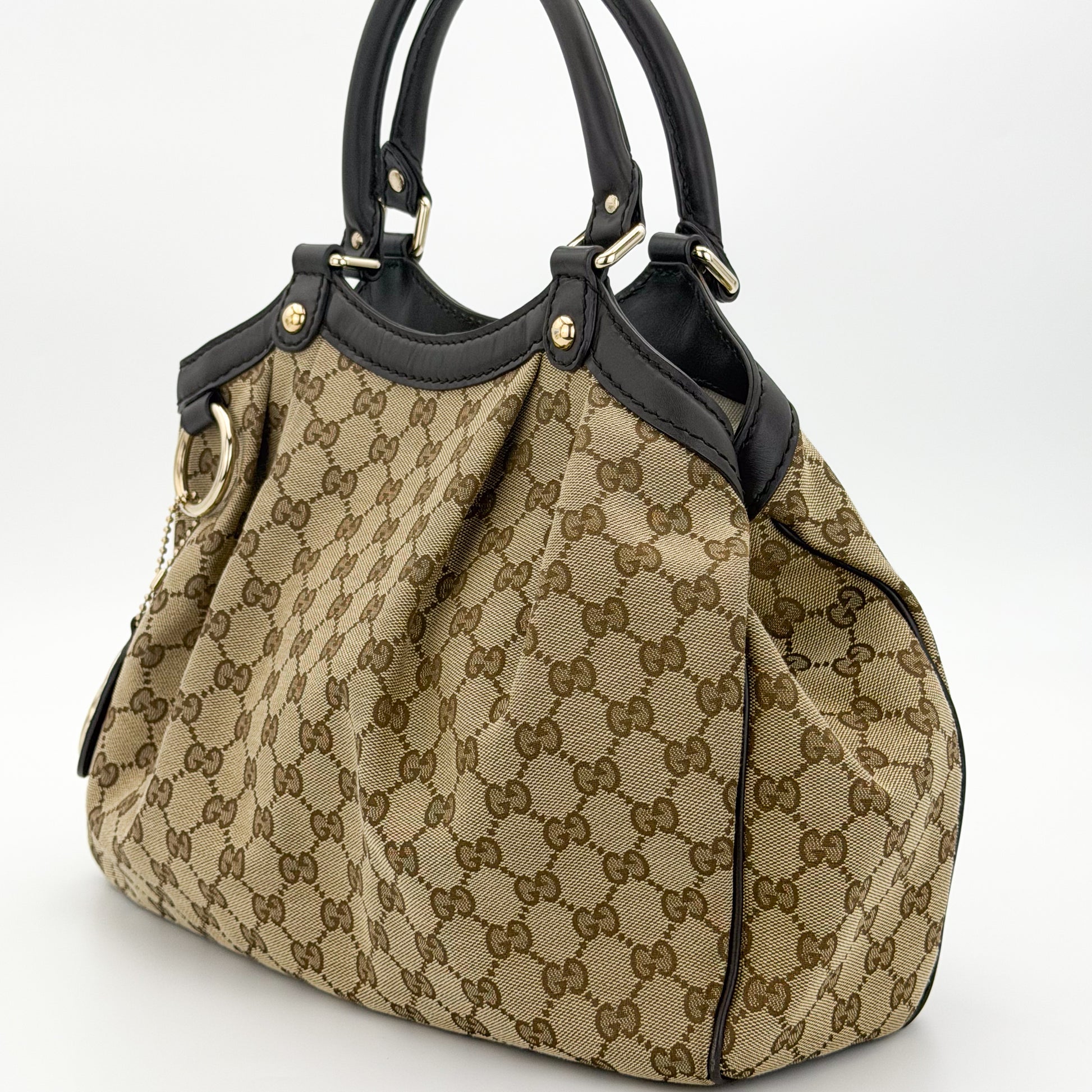 Gucci Sukey tote left side view with gold-tone hardware detail