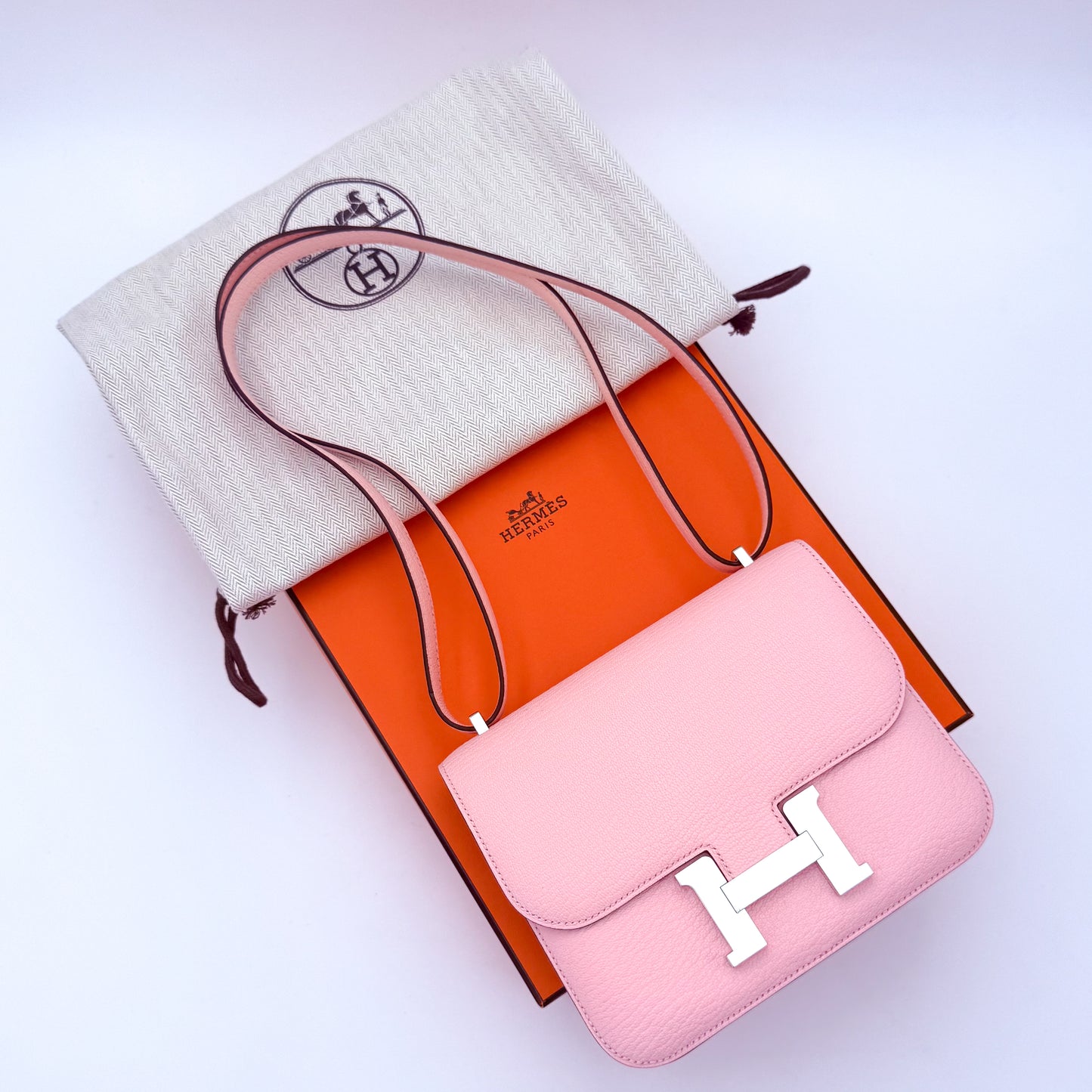Hermès Constance 18 Rose Sakura Chèvre Mysore with original orange Hermès box and dust bag — full set.