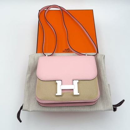 Hermès Constance 18 Rose Sakura Chèvre Mysore with original orange Hermès box and dust bag — front view.