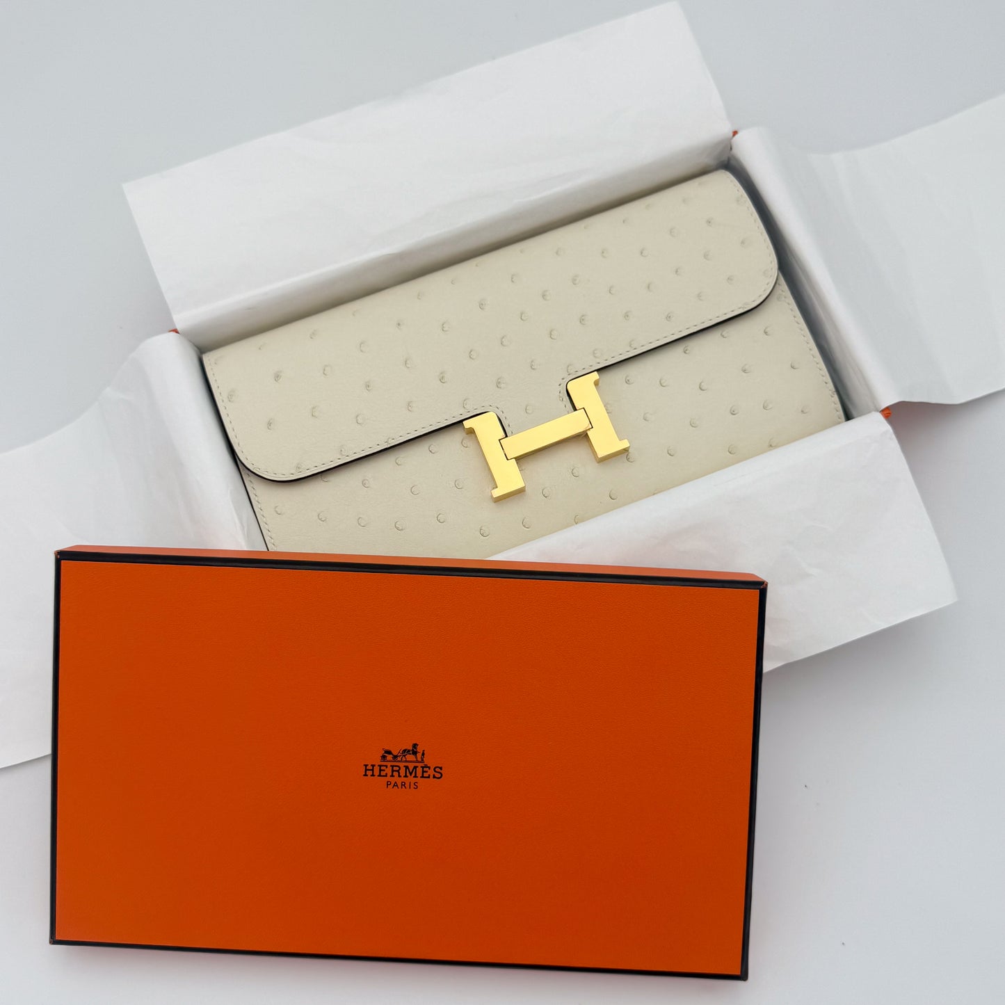 Brand New Hermès Constance To Go in Nata ostrich with gold hardware and original orange box.