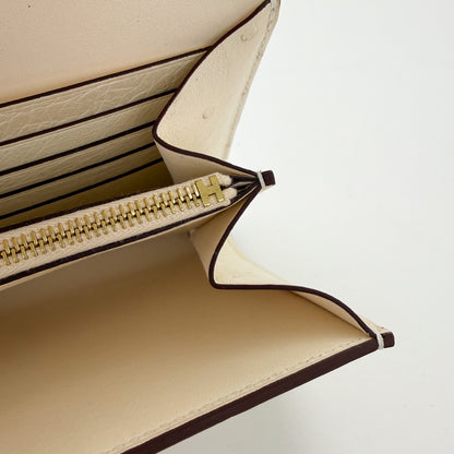 H Stamp on gold hardware on the zipper end of a Hermes Constance to Go 