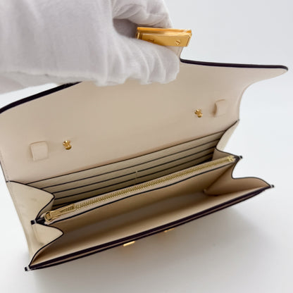 Interior view of a brand new Hermès Constance To Go in Nata ostrich with gold hardware.
