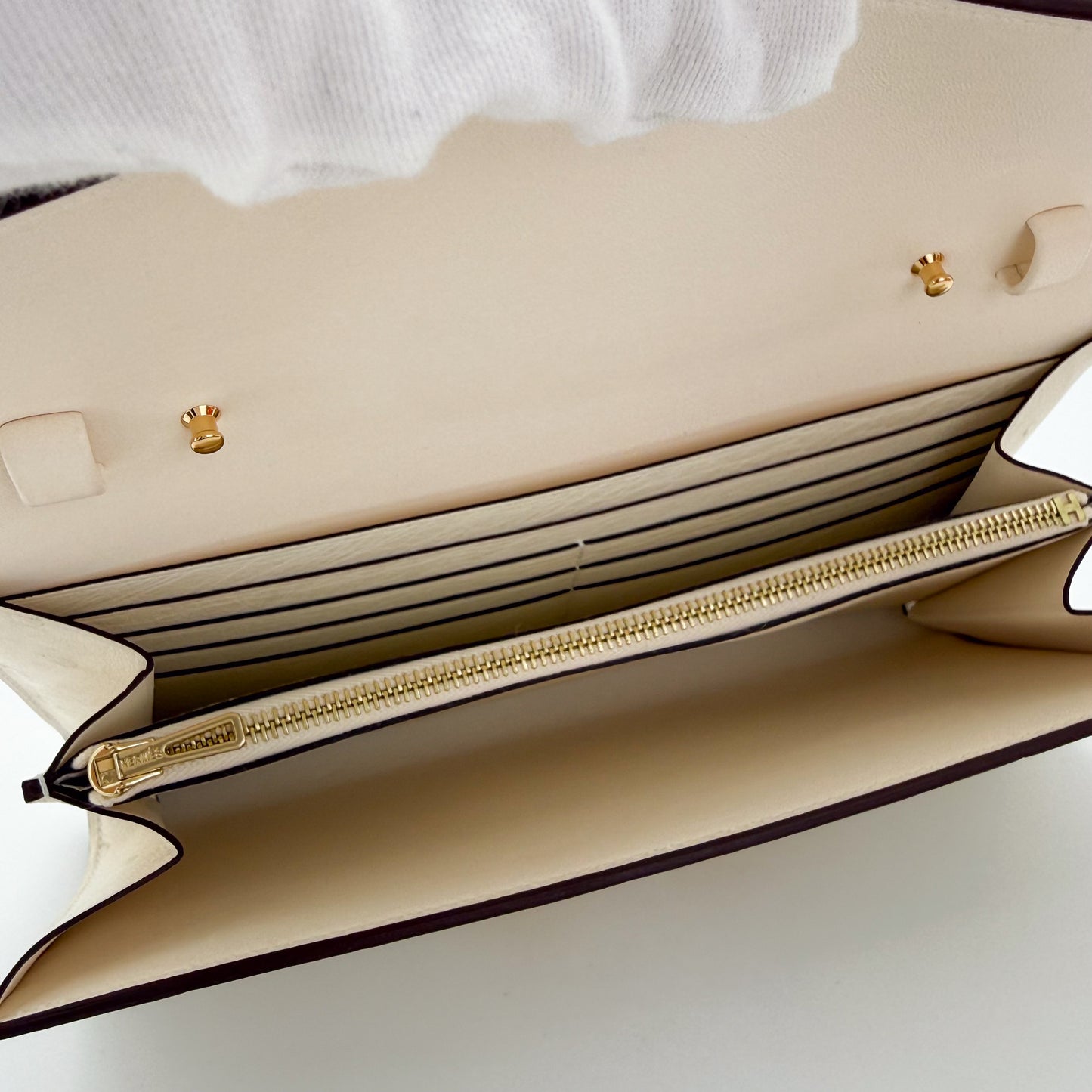 Interior view of a brand new Hermès Constance To Go in Nata ostrich with gold hardware 