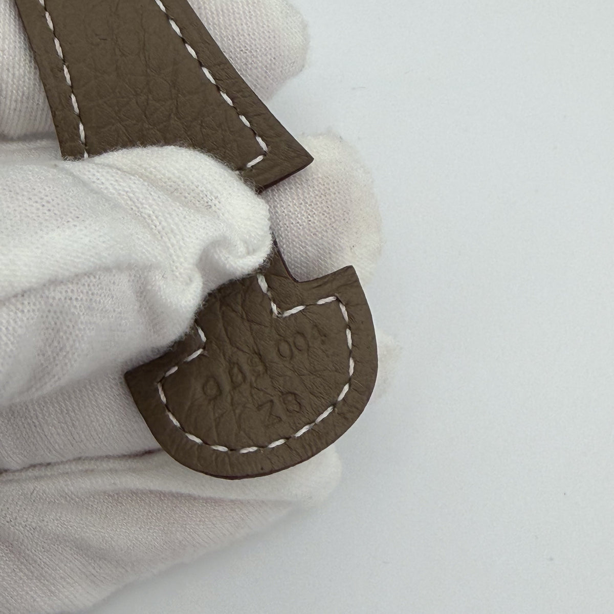 Hermès blind stamp and leather craftsmanship detail, Evelyne III