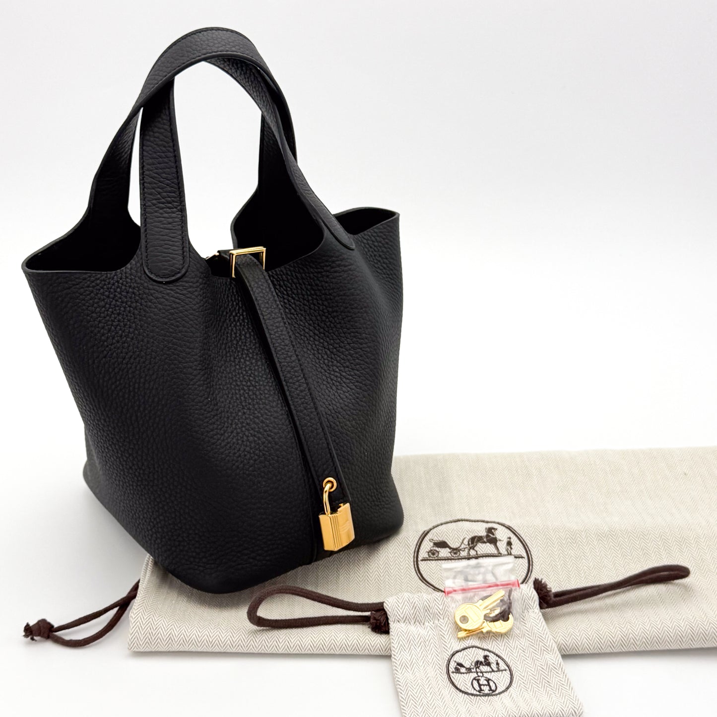 Brand New Hermès Picotin 18 Lock in Black Clemence Leather with gold hardware, lock, key and packaging.