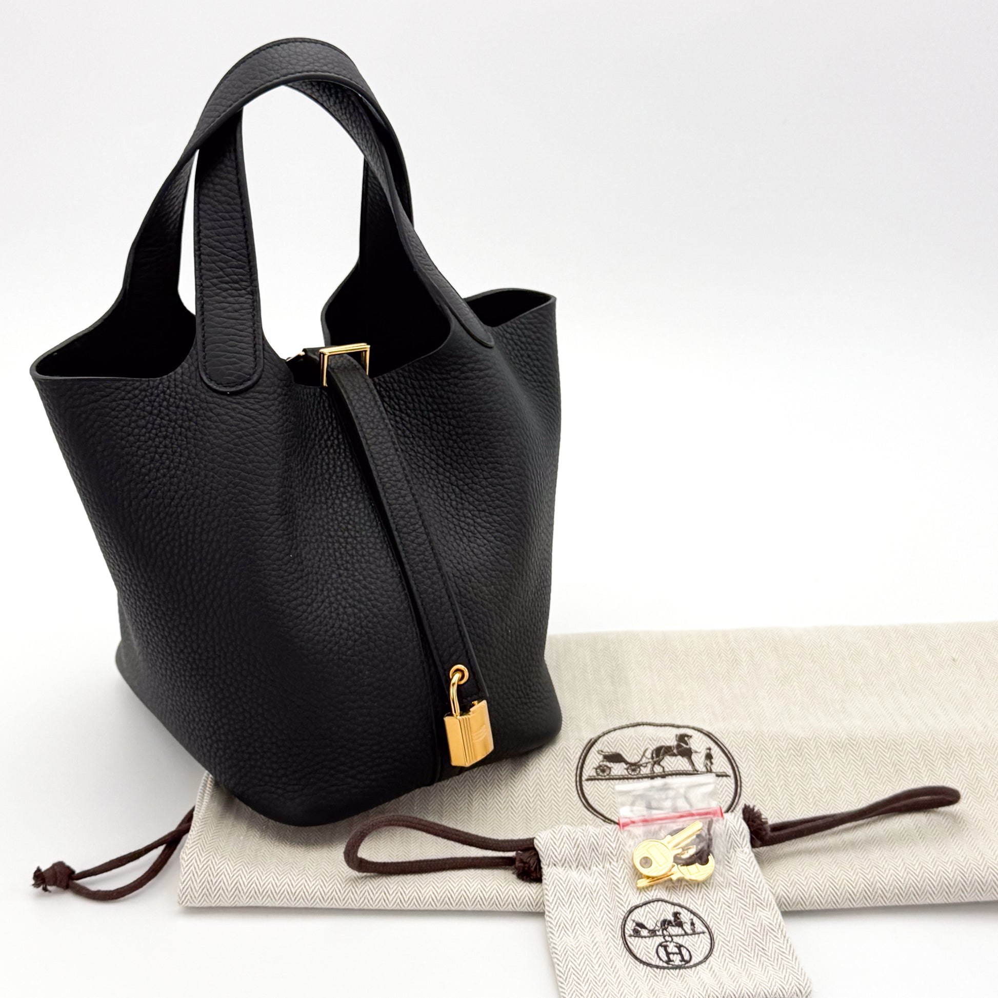 Brand New Hermès Picotin 18 Lock in Black Clemence Leather with gold hardware, lock, key and packaging.