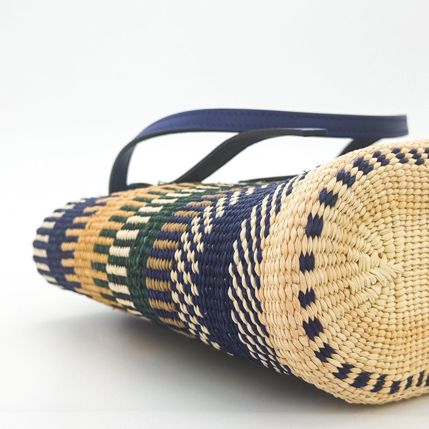 Loewe x Paula's Ibiza Square Basket Bag in striped raffia with cobalt blue leather handles — side view