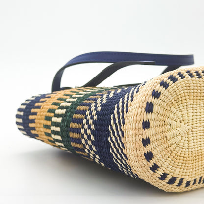 Loewe x Paula's Ibiza Square Basket Bag in striped raffia with cobalt blue leather handles — side view